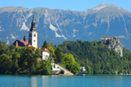 Bled Island with Bled Castle and the Alps behind